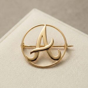 a letter gold brooch